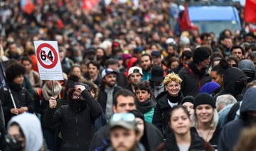 Macron signs France pension reform into law despite protests