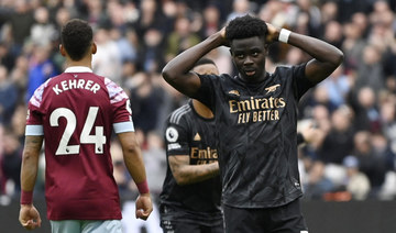 Arsenal’s Bukayo Saka reacts after he misses a penalty in his team’s 2-2 draw with West Ham United. (Reuters)