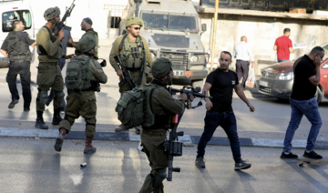 Israeli forces raid towns, arresting Palestinians