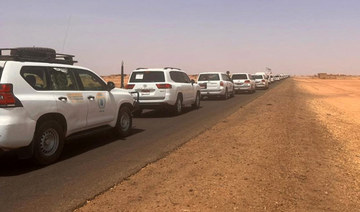 A convoy leaving Khartoum advances on a road towards Port Sudan, on April 23, 2023, as people flee Khartoum.