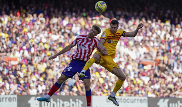 Barcelona ends Atletico’s winning run, moves closer to title