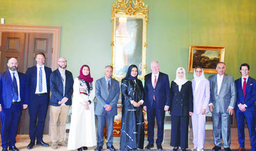 Saudi delegation headed by Assistant Speaker Hanan Al-Ahmadi pose for a group photo with officials in Stockholm. (Supplied)