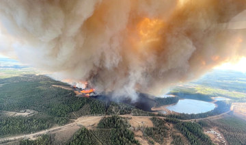 A smoke column rises from wildfire EWF031 near Lodgepole, Alberta, Canada May 4, 2023. (REUTERS)