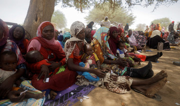 Sudanese refugees wait for medical consultation at Premiere Urgence International clinic near the border between Sudan and Chad.