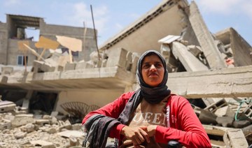 Gazans amid the rubble of homes flattened by fighting