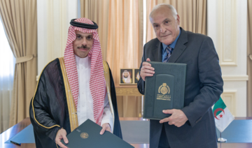 Saudi Arabia’s Foreign Minister Prince Faisal bin Farhan and his Algerian counterpart Ahmed Attaf sign an agreement in Jeddah.