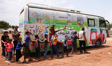 Children in quake-hit Syria learn in buses turned classrooms