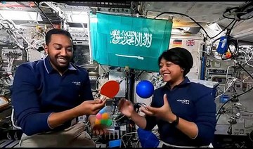 Saudi astronauts Rayyanah Barnawi and Ali Al-Qarni conduct an educational experiment with school students in the Kingdom.