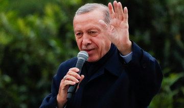 Turkish President Tayyip Erdogan addresses his supporters following early exit poll results.