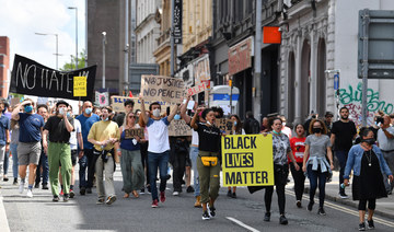 Protesters with banners and placards march from Toxteth into central Liverpool in support of the Black Lives Matter movement.
