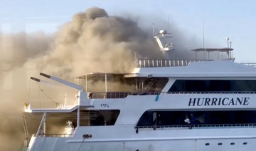 Plumes of smoke erupt from a yacht on fire in Marsa Alam, Egypt, June 11. (Reuters)