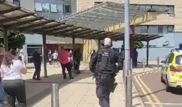 Armed police responding to an incident at Central Middlesex Hospital in west London. (Screengrab)