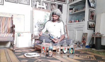 In southern Pakistan, a master of creating art on the inside of bottles