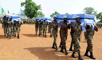 UN peacekeepers carry the coffins of the three UN soldiers from Bangladesh during a ceremony n Bamako, Mali. (Reuters)