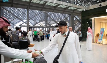 Hajj pilgrims are greeted with Zamzam water and gifts on arrival in Madinah after travelling on the Haramain High-Speed Railway.