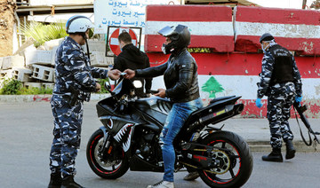 A police officer checks a motorcyclist in the Lebanese capital Beirut. (AFP file photo)