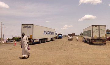 Trucks carrying foreign humanitarian aid pass by Gadaref on the main road linking Khartoum with Port Sudan on July 10, 2023.