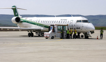 An Iraqi Airways Canadair CRJ-900 jet plane on the tarmac at the airport in the Iraqi Kurdish city of Sulaimaniyah. (AFP)