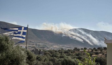 Wildfire burns forests north of Athens, fires weaken in southeast and west