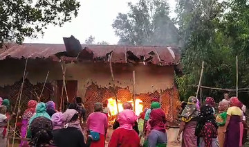 Women burn down houses of two accused over India women assault video 