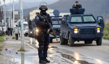 Members of the Kosovo police special unit stand guard in the town of Mitrovica. (AFP file photo)