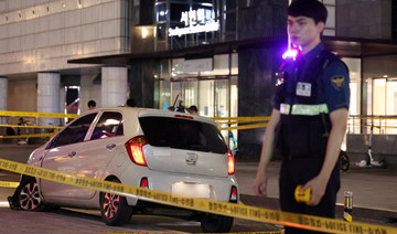 13 injured in South Korea when a man rams a car onto a sidewalk and stabs pedestrians