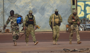 This undated photograph provided by the French military shows three Russian mercenaries in northern Mali. (AP)