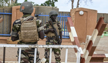 Nigerien police soldiers stand guard outside the Niger and French air bases in Niamey.