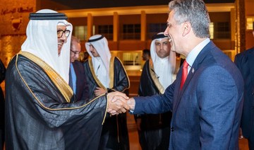 Bahrain’s Foreign Minister Abdullatif bin Rashid Al-Zayani receives his Israeli counterpart Eli Cohen upon his arrival in Manama