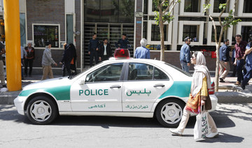 An Iranian police vehicle is seen parked outside a currency exchange shop in the capital Tehran. (AFP file photo) 