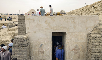 People visit a newly discovered ancient tomb in the Saqqara necropolis south of Cairo. (File/AFP)