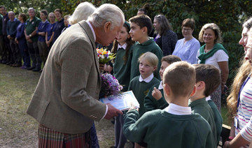 Gun salutes and reflection as UK remembers Queen Elizabeth II