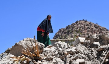A woman searches through the rubble in the Taroudant province, one of the most devastated in quake-hit Morocco, on September 11.