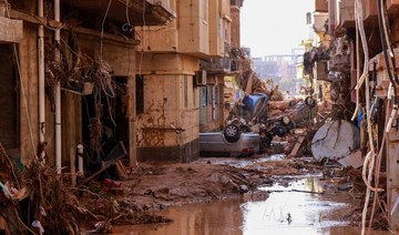Overturned cars lay among other debris caused by flash floods in Derna, eastern Libya, on September 11, 2023. (AFP)