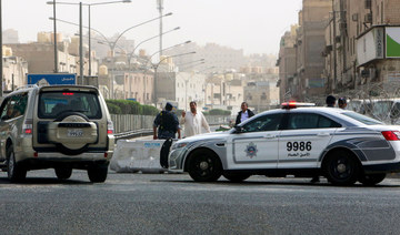 Kuwaiti police officers stand guard in Kuwait City. (AFP file photo)