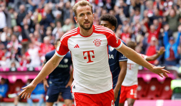 Record-setting Kane hits hat-trick as Bayern rout Bochum