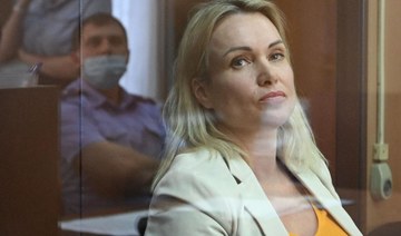 Russian journalist who staged TV war protest handed 8-1/2-year jail term in absentia