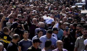 A Reuters videographer killed in southern Lebanon by Israeli shelling is laid to rest