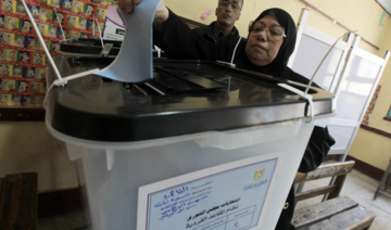 An Egyptian woman votes in a previous presidential election. (File/AFP)