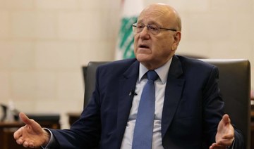 Lebanon’s caretaker prime minister Najib Mikati smiles during an interview with AFP at his office in Beirut on Oct. 30, 2023.