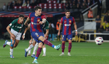 Lewandowski double rescues Barca, Atletico beat Villarreal