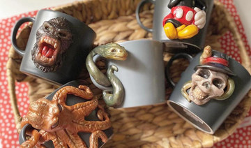 Saqid specializes in creating handmade mugs with three-dimensional figures of animals and humans. (Supplied)