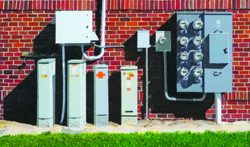 ‘Electric Series, Triptych’ by Yusef Fageeh is a collection of three hyper-realistic paintings of electric boxes. (Supplied)