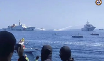 Chinese ships assault Philippine fisheries vessels en route to disputed shoal