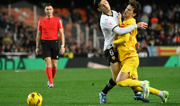 Barcelona held at Valencia for third game without a win. Sevilla fire coach Diego Alonso