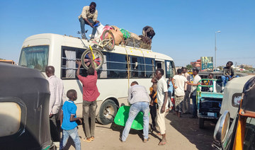 Displaced people fleeing from Wad Madani in Sudan's Jazira state arrive in Gedaref in the country's east on December 17, 2023. 