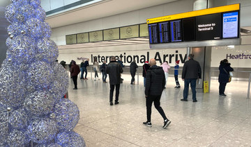 People wait in the arrivals hall at terminal 5 of Heathrow Airport, near London, Britain. (REUTERS file photo)