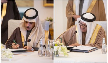 Saudi FM Prince Faisal bin Farhan and Bahraini FM Abdullatif bin Rashid Al-Zayani sign documents during a meeting in Riyadh.