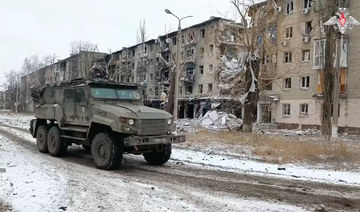 Ukrainian soldiers expect more assaults after Russian forces capture eastern town