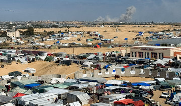 Smoke rises during Israeli ground operation in Khan Younis, as seen from a tent camp sheltering displaced Palestinians in Rafah.